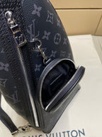 Dark monogram sling bag front zipper and zip pocket detail