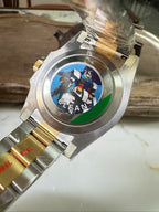 Rolex Submariner caseback with engraved emblem and two-tone metal bracelet