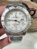 Rolex watch with silver dial, stainless steel bracelet, and chronometer subdials