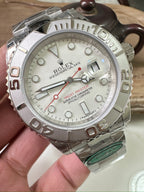 Rolex watch with silver dial, stainless steel bracelet, and applied hour markers