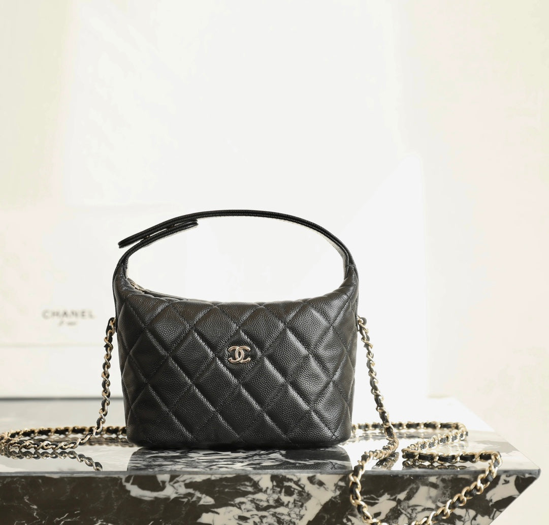 Black quilted Chanel mini handbag with CC logo and gold chain strap