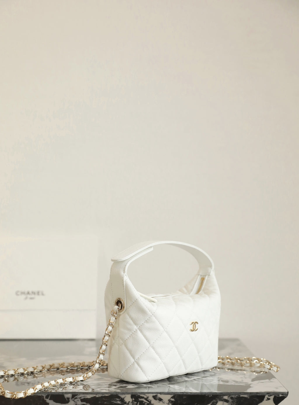 Chanel white quilted mini handbag with gold chain strap and top handle