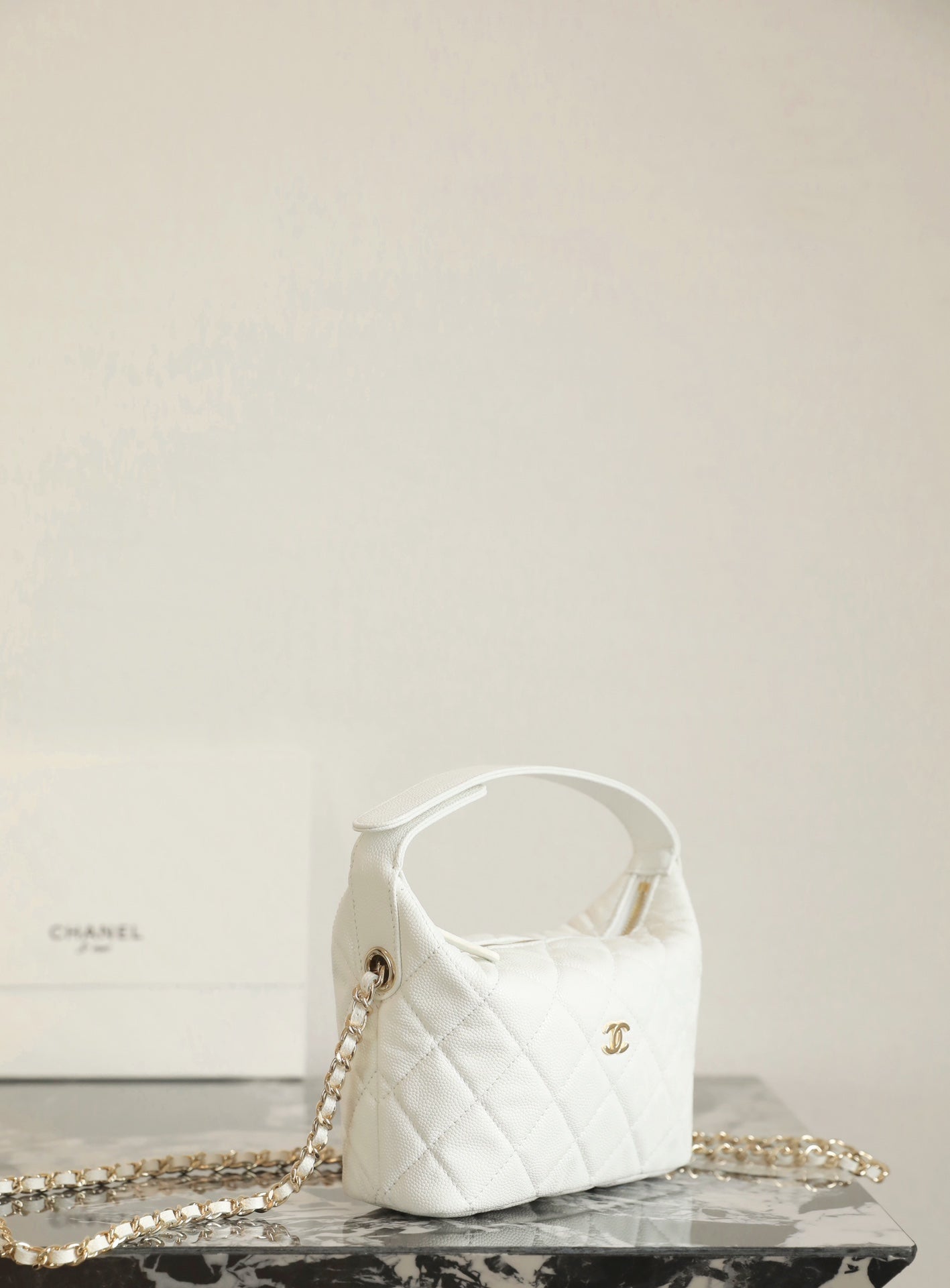 Chanel white quilted mini handbag with gold chain strap and top handle