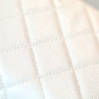 White quilted leather fabric with diamond stitch pattern