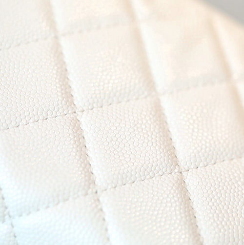 White quilted leather fabric with diamond stitch pattern