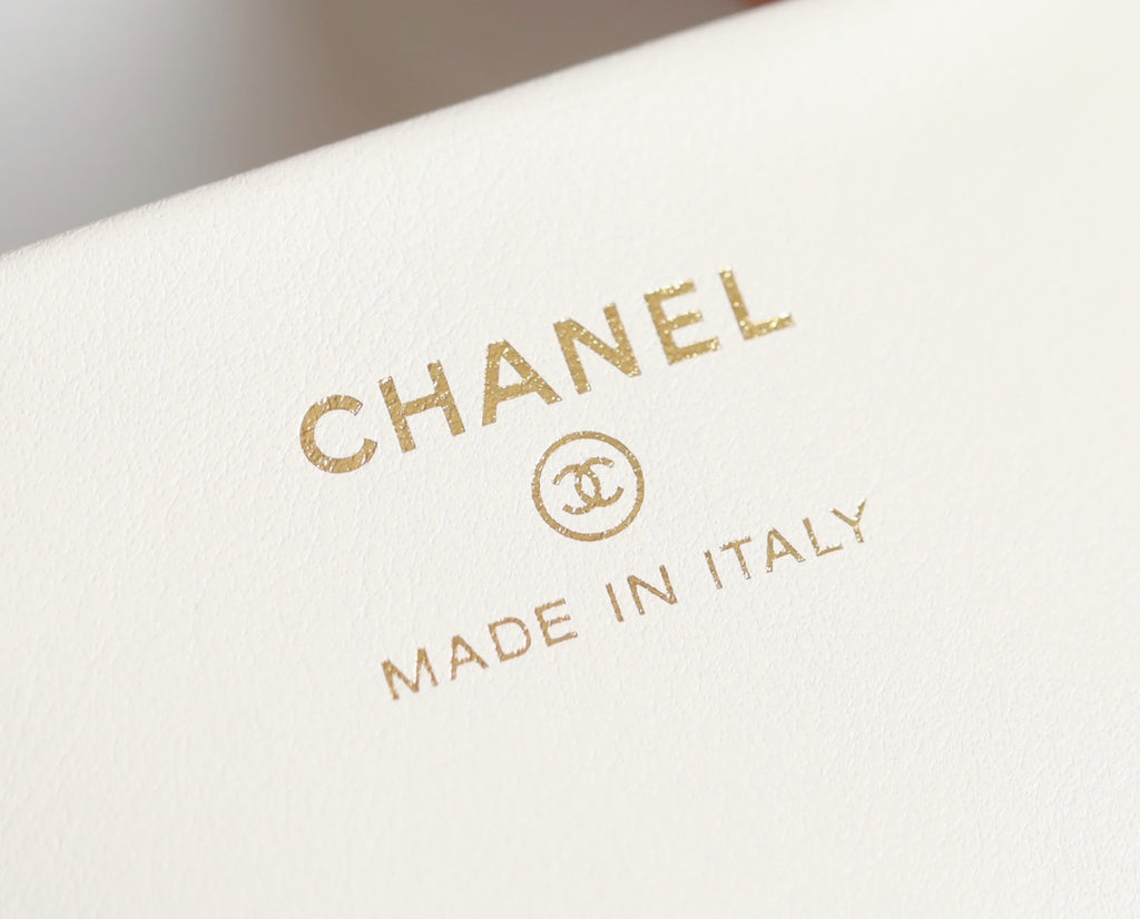 Chanel logo mark with “MADE IN ITALY” on white leather label