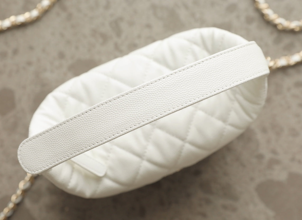 White quilted leather handbag with textured leather top handle strap