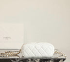 Chanel white quilted mini handbag with gold chain strap, back view