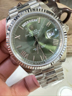Stainless steel Rolex wristwatch, green dial with date window and fluted bezel