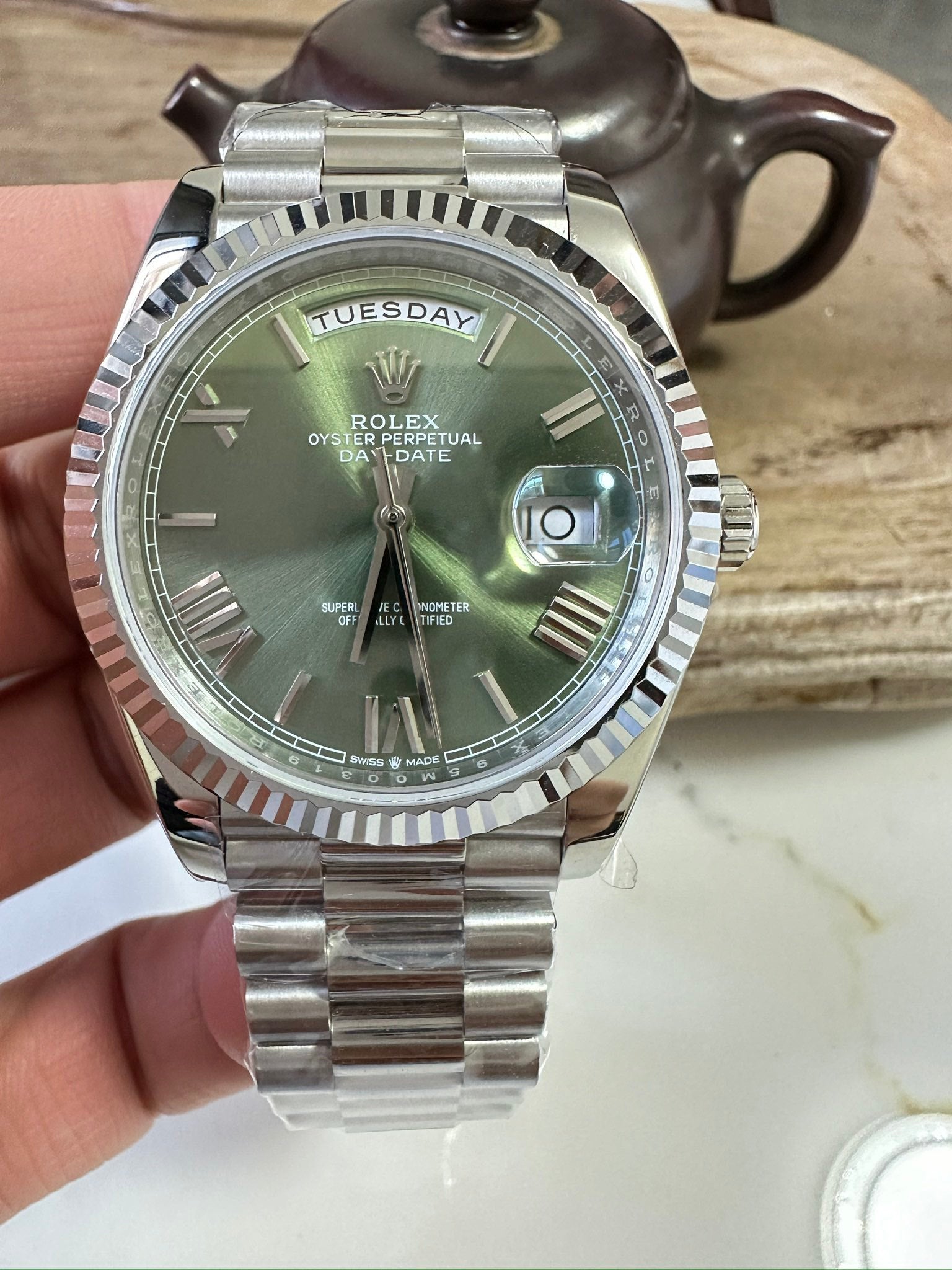 Stainless steel Rolex wristwatch with green dial, date window, jubilee bracelet