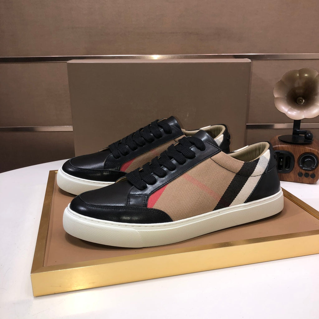 Burberry lace-up sneakers, black leather with beige fabric panel and white midsole.