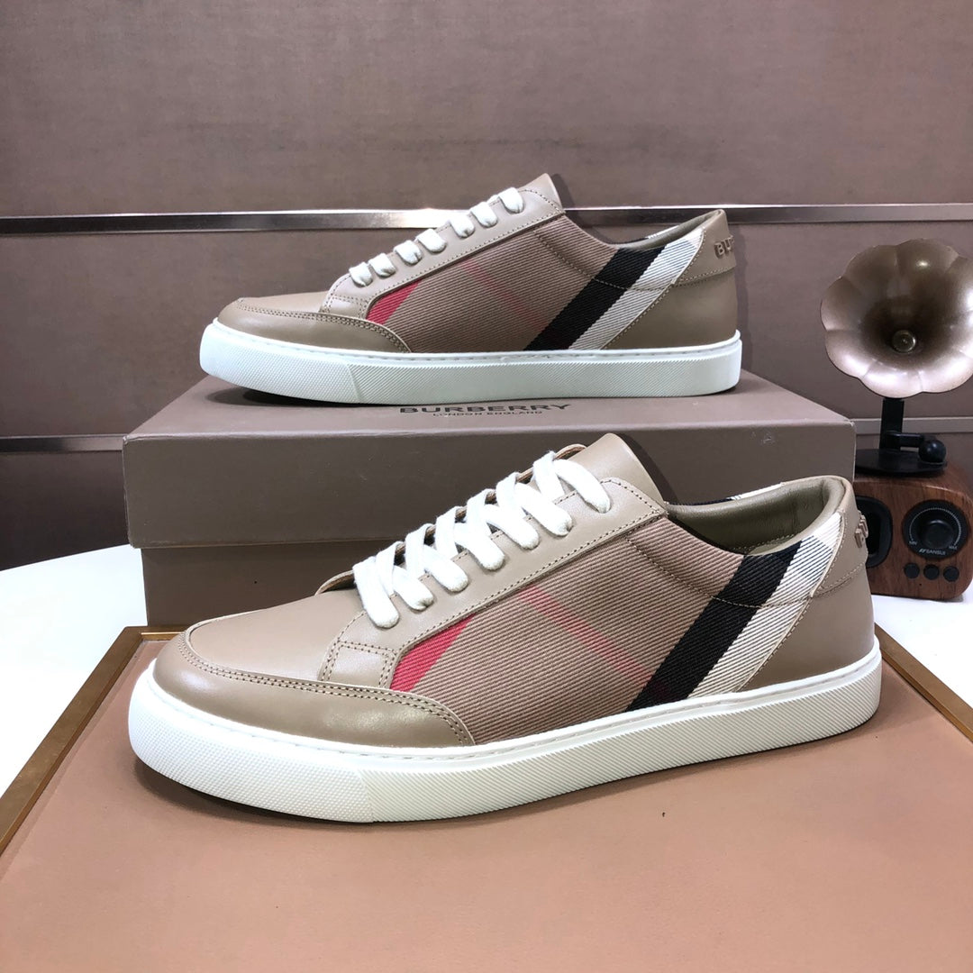 Beige low-top sneakers with plaid stripe, white laces, and thick white sole