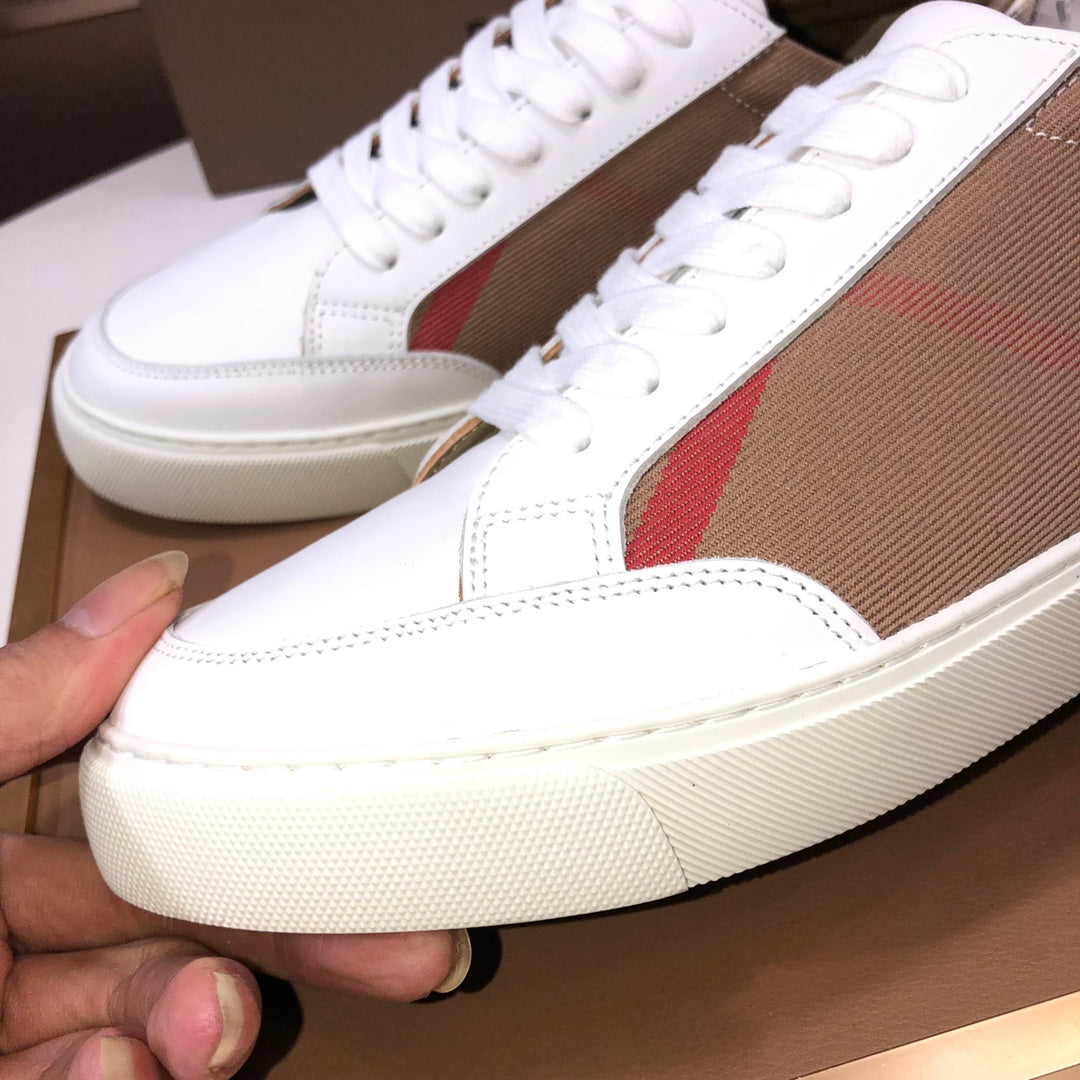 Close-up of Burberry low-top sneakers with white laces and tan check side panel