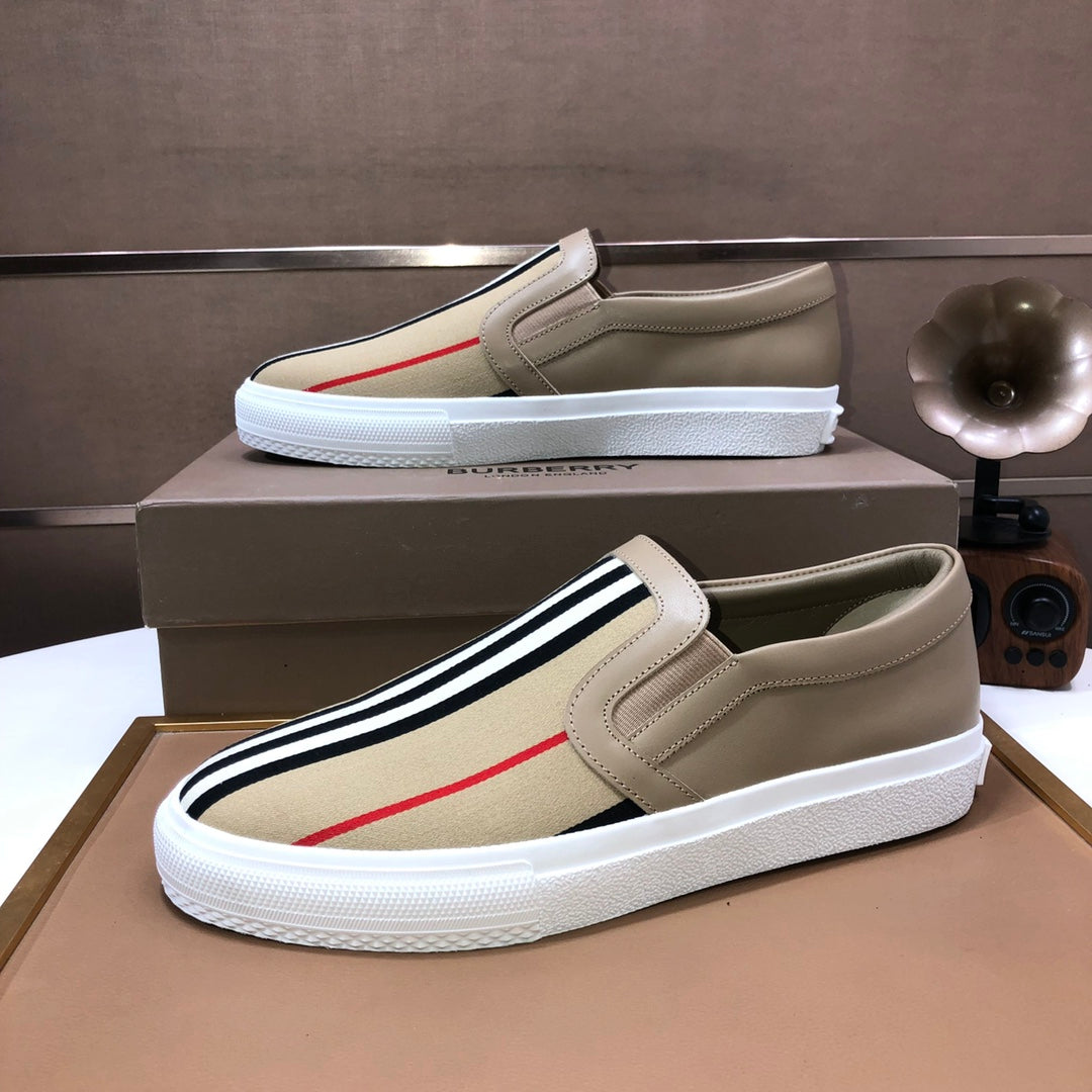 Beige slip-on sneaker with striped side band and red accent line, white sole
