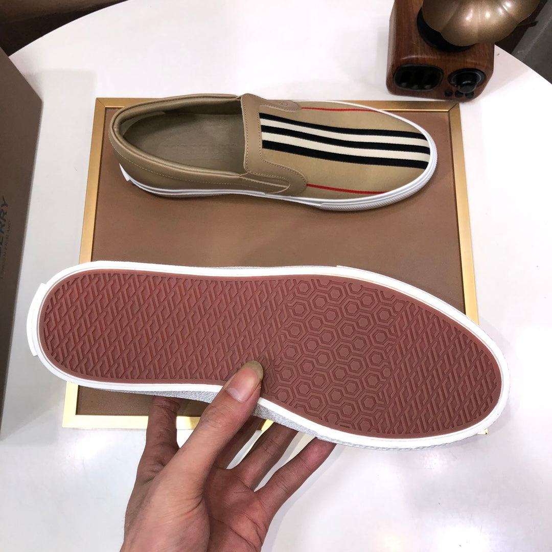 Beige slip-on sneaker outsole with textured tread and white edge