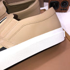 Beige slip-on sneaker with smooth upper and textured white sole