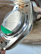 Rolex watch side view, two-tone steel case and bracelet with ridged bezel