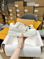 Louis Vuitton white lace-up trainer shoe with padded panels and chunky tread sole