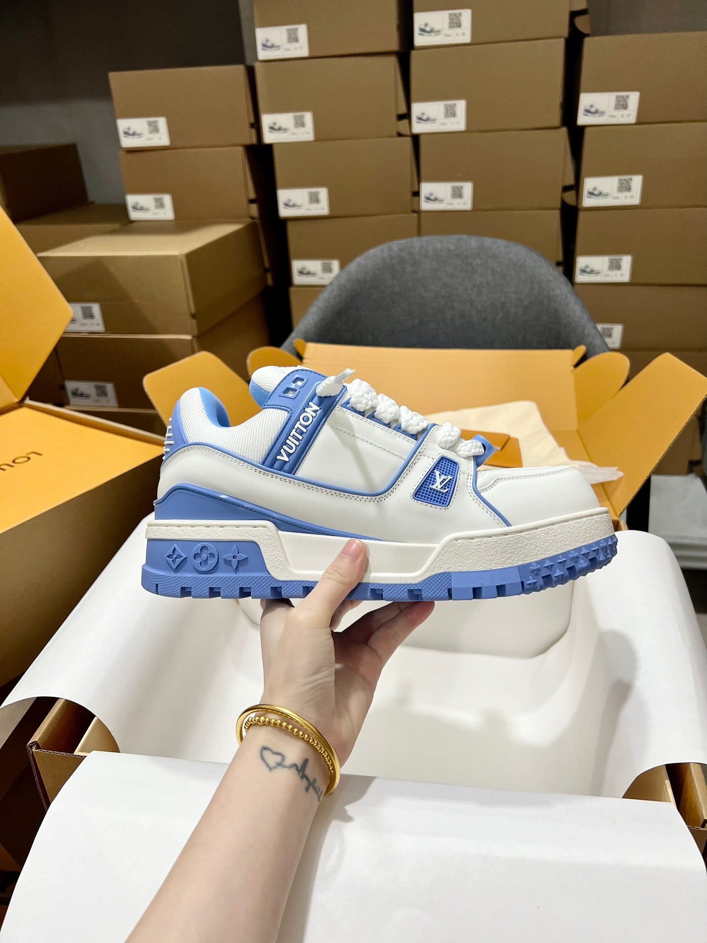 Louis Vuitton blue and white lace-up trainer shoe with logo patch and textured sole