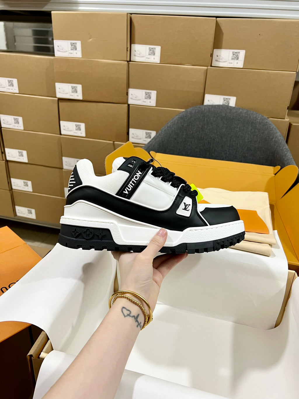 Black and white trainer sneakers with monogram strap and chunky rugged sole