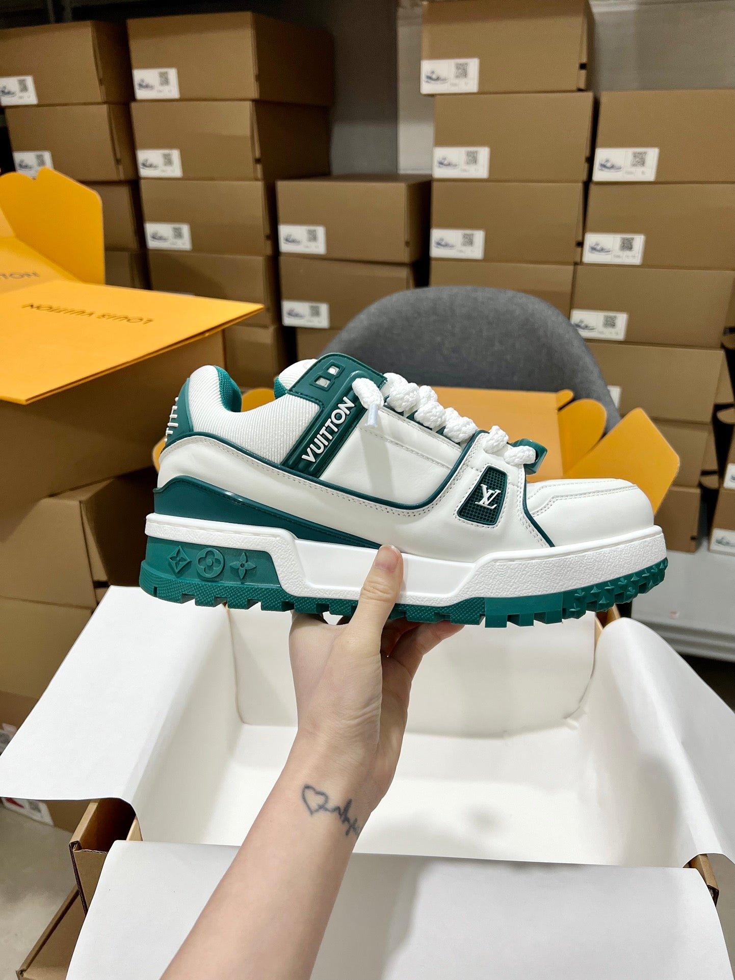 White and teal trainer sneakers with monogram strap and chunky rugged sole