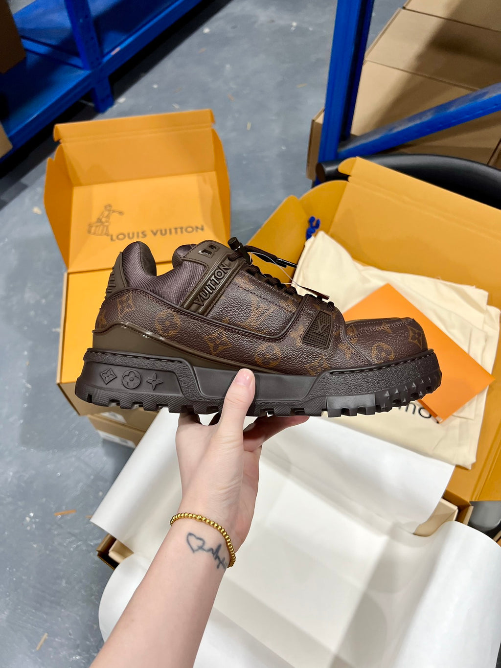 Louis Vuitton lace-up trainer shoe in dark brown with logo details and chunky tread sole