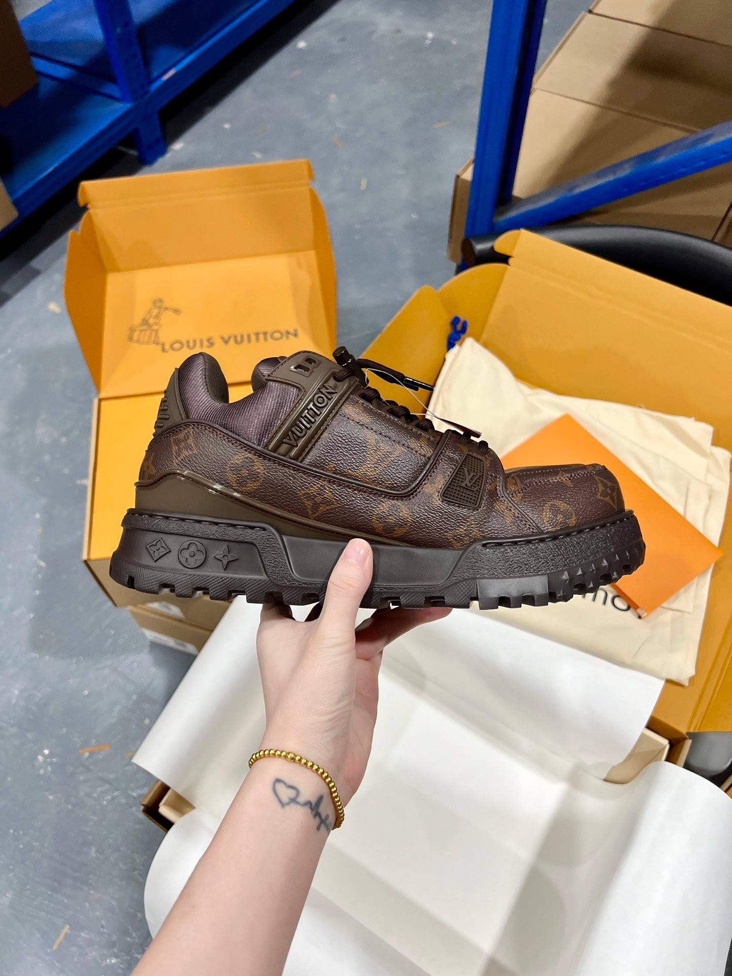 Louis Vuitton lace-up trainer shoe in dark brown with logo details and chunky tread sole