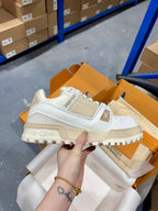 Louis Vuitton lace-up trainer shoe in white with logo patch and chunky dark sole
