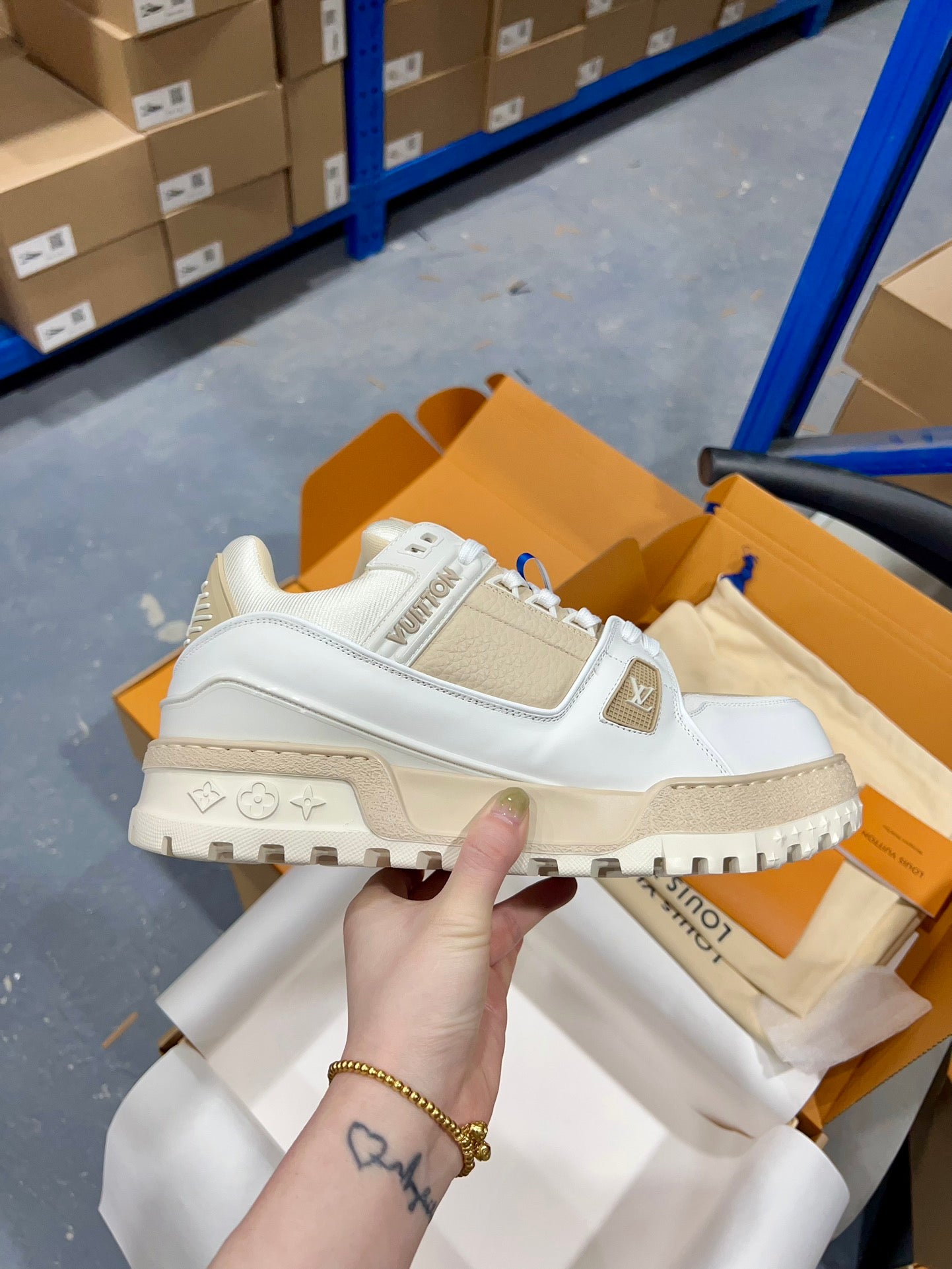 Louis Vuitton lace-up trainer shoe in white with logo patch and chunky dark sole