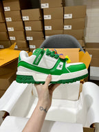 Green and white trainer sneakers with monogram strap and chunky rugged sole