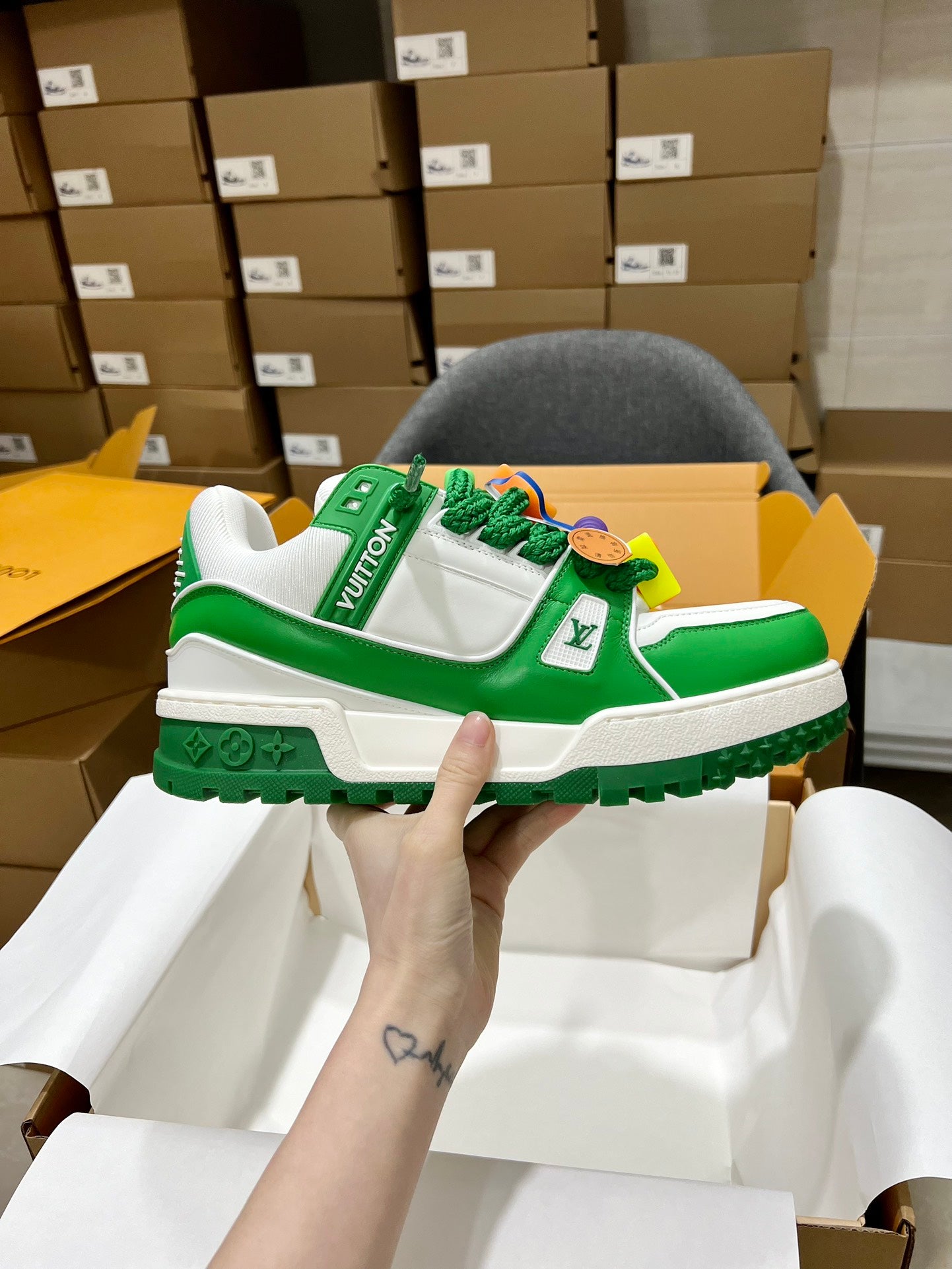 Green and white trainer sneakers with monogram strap and chunky rugged sole