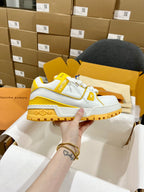 White and yellow trainer sneakers with monogram strap and rugged chunky sole