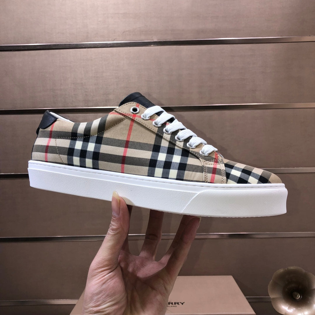 Burberry low-top sneaker held up, beige plaid with white laces and black side panel