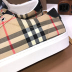 Burberry low-top sneaker close-up, beige check canvas with black heel tabs