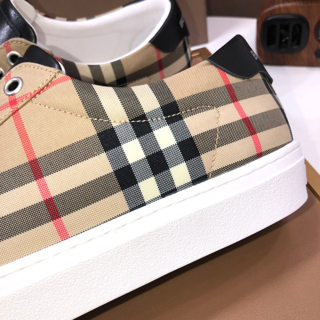 Burberry low-top sneaker close-up, beige check canvas with black heel tabs