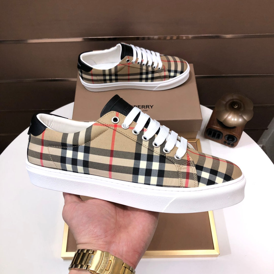 Burberry low-top sneakers on display, beige check pattern with white laces and black details
