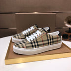 Burberry low-top sneakers in beige, black, and red check plaid with white laces