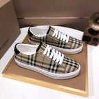 Burberry plaid canvas sneakers on box, white rubber sole and metal eyelets