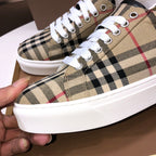Burberry check plaid sneakers close-up, white laces, canvas and metal eyelets