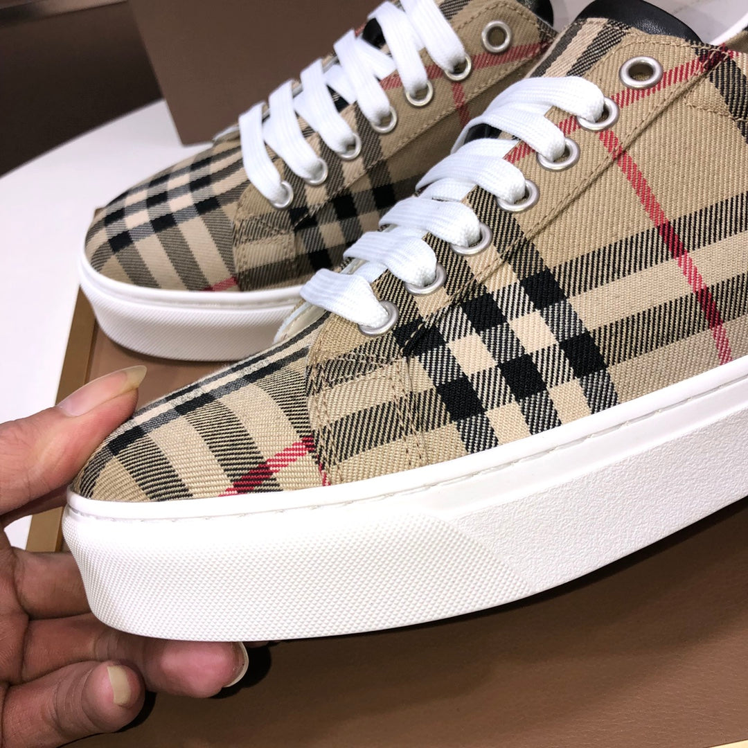 Burberry check plaid sneakers close-up, white laces, canvas and metal eyelets