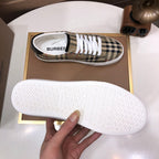 Burberry sneaker outsole view, textured tread on white rubber sole