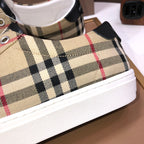 Burberry plaid sneaker side close-up with white rubber midsole
