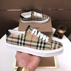 Burberry plaid canvas sneakers with white laces and thick white rubber sole