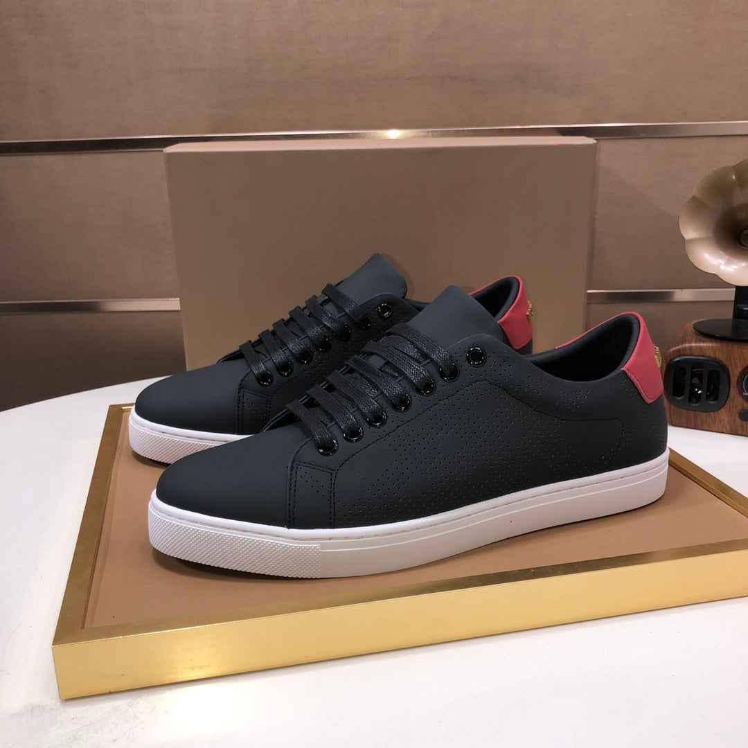 Burberry dark leather sneakers on display box, lace-up front, white sole
