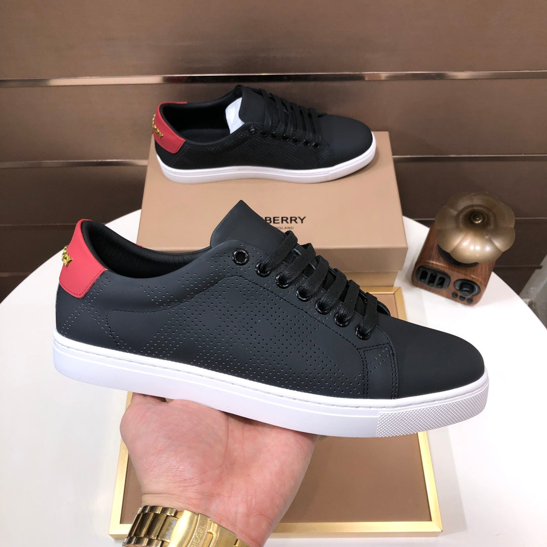 Burberry dark leather sneakers with red heel tab and white platform sole
