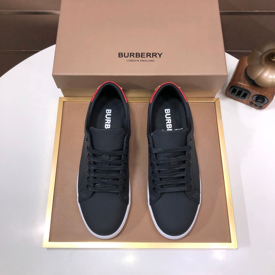 Burberry dark leather lace-up sneakers with red heel accent and white rubber sole
