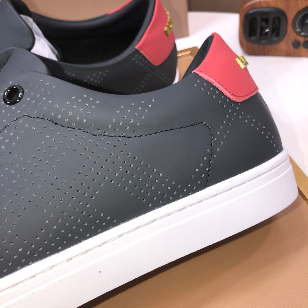 Burberry dark leather sneaker side, perforated pattern and red heel strap