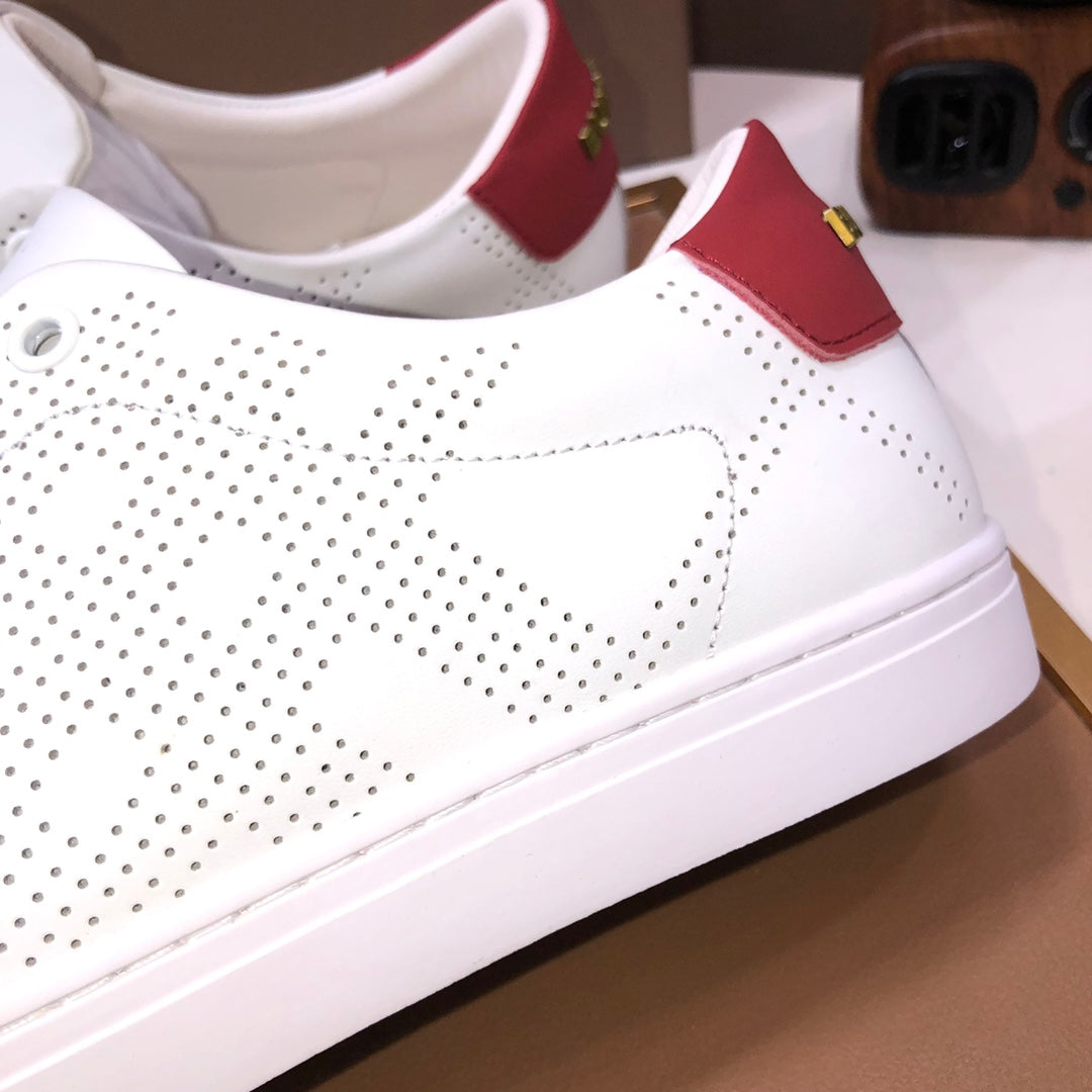 Burberry white sneakers with red strap detail and perforated upper