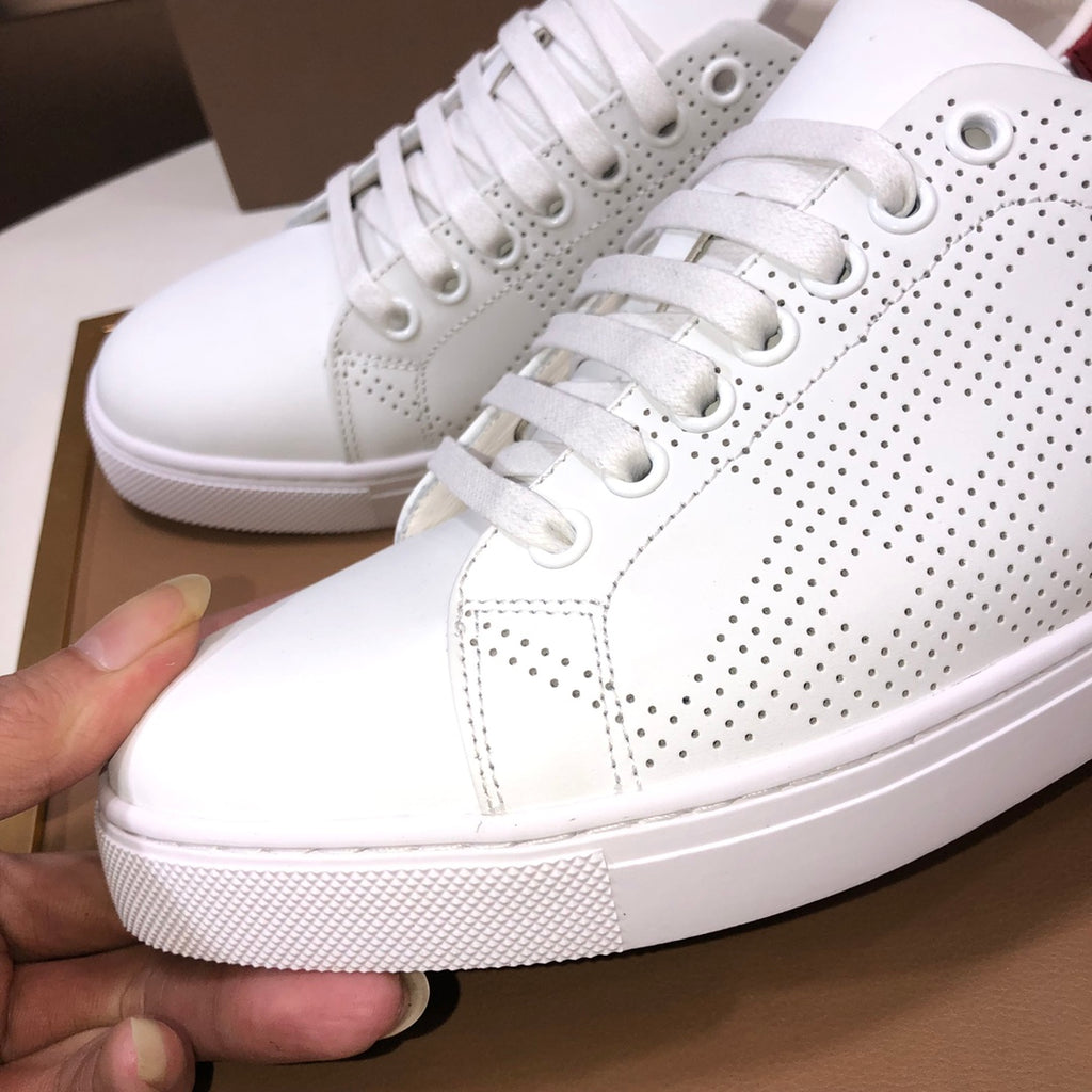 Burberry white leather sneaker with perforated dots and white laces, side view