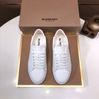 Burberry white leather sneakers with red heel tabs and perforated detailing, lace-up